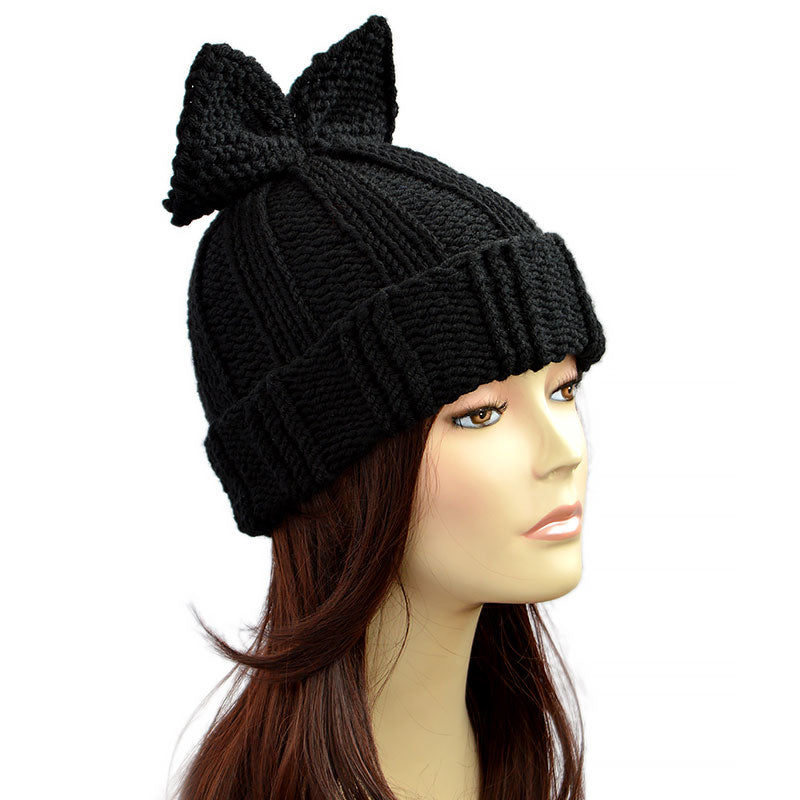 I made this knitted hat with bow in black, but you can choose any color. Womens bow hat made of thick yarn and with a turn-up so bow hat very warm and suitable for even the coldest regions.